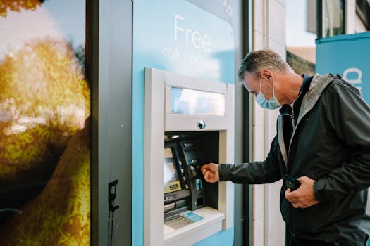 Man Using ATM Machine 